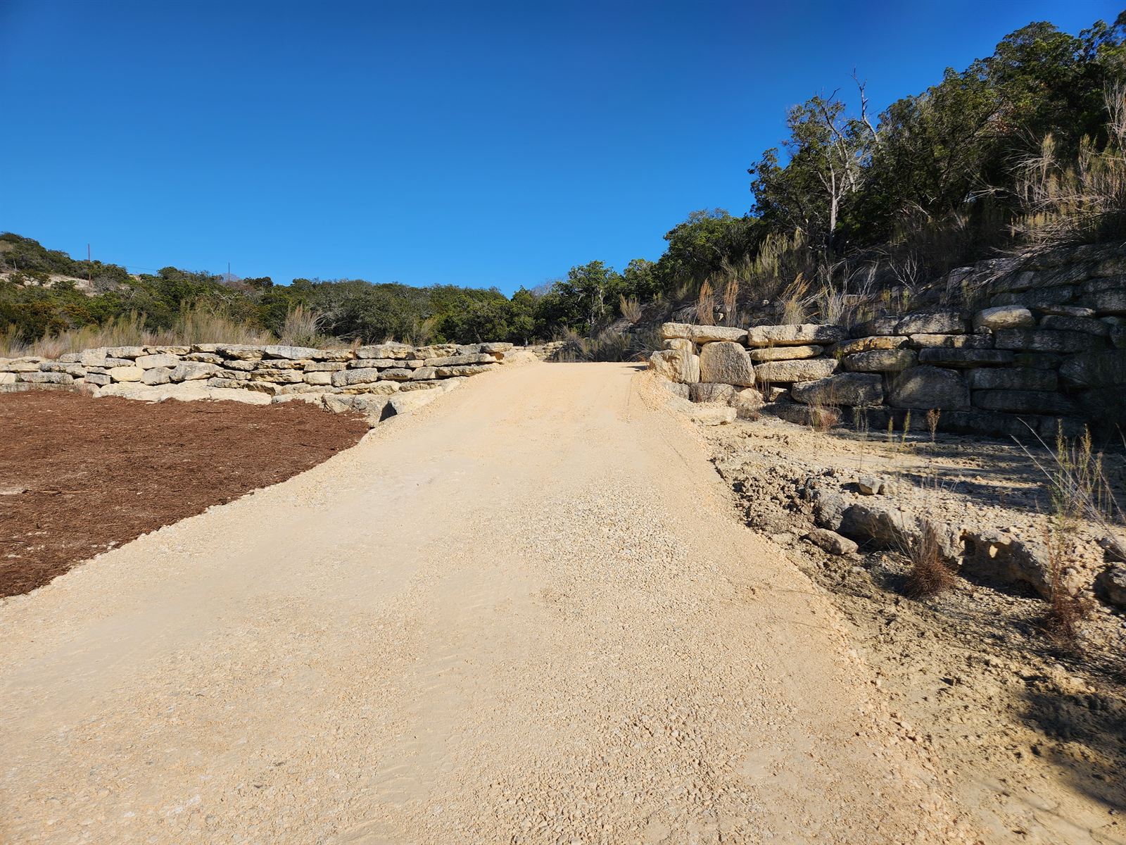 Graded and surfaced approach drive edged with limestone