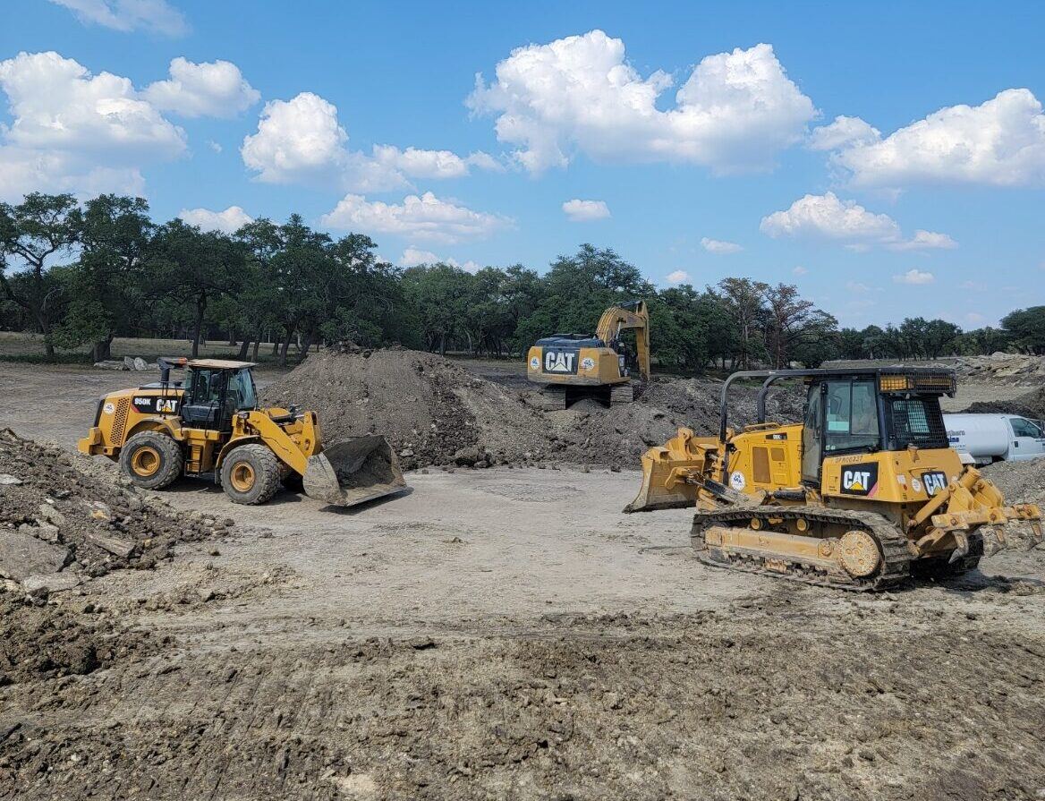 Dozer and loader clearing a large commercial site